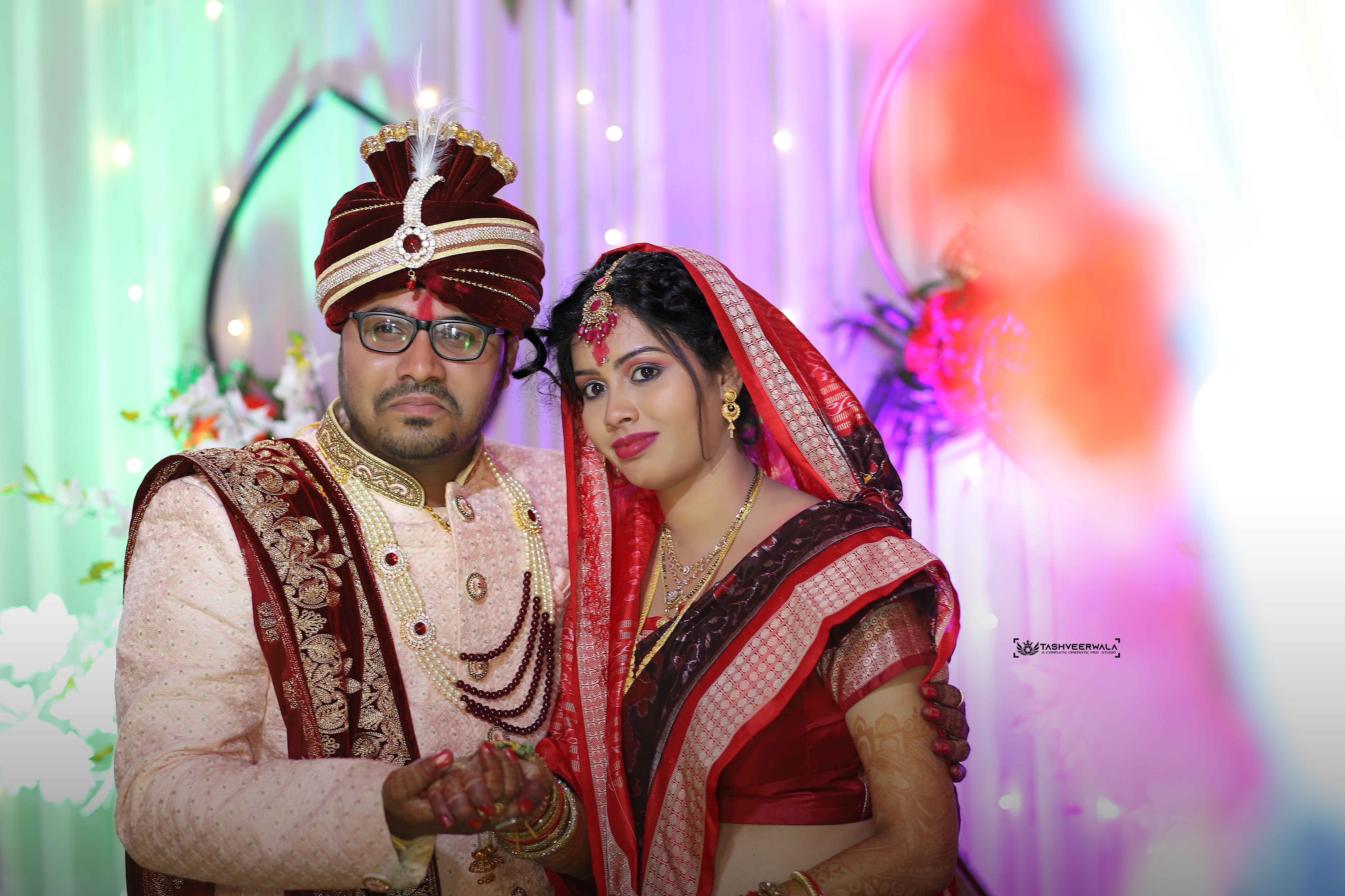 Traditional wedding ceremony couple with vibrant colorful lighting and bokeh background